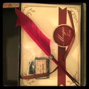 A ink pen that you dip into an ink cup (provided)